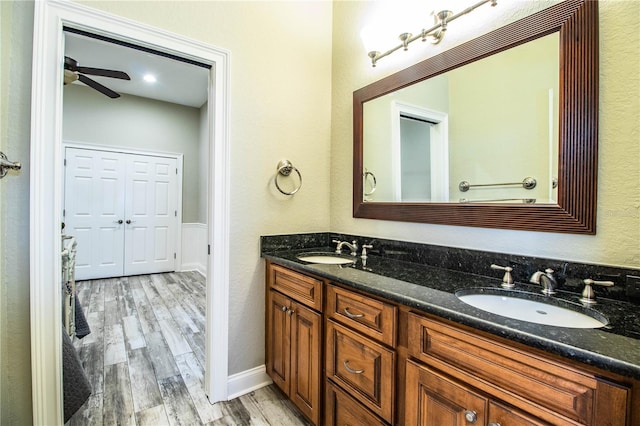 bathroom featuring vanity, ceiling fan, and hardwood / wood-style flooring