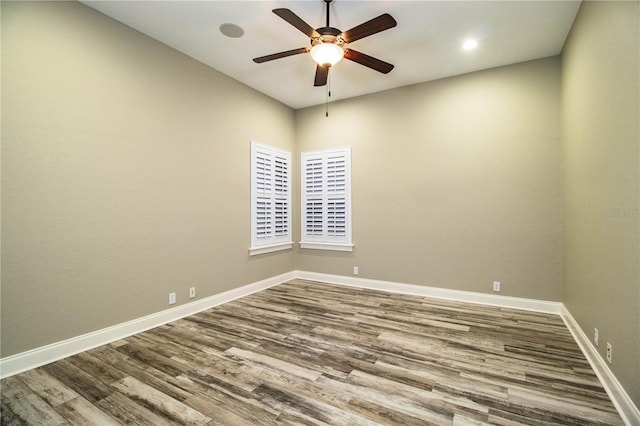 empty room featuring ceiling fan and hardwood / wood-style flooring