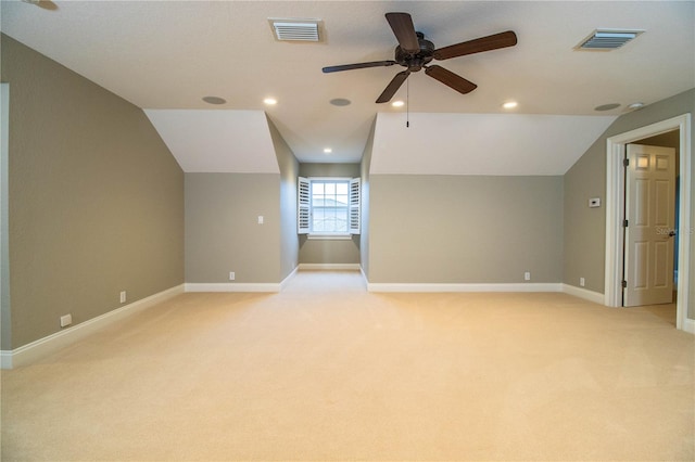 additional living space featuring lofted ceiling, ceiling fan, and light colored carpet