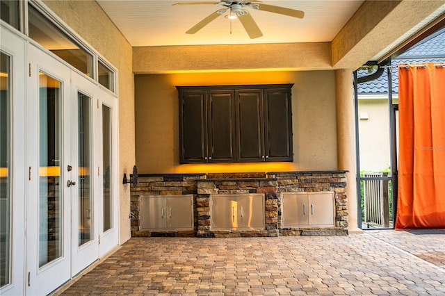 view of patio / terrace featuring area for grilling, ceiling fan, and french doors