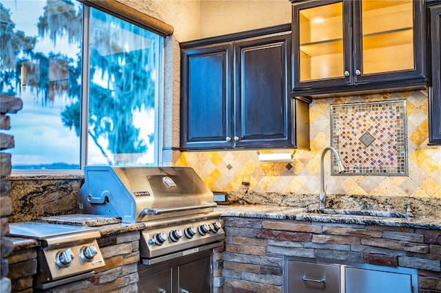 kitchen featuring sink and tasteful backsplash