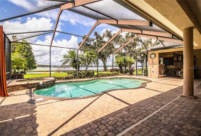 view of pool with a water view, ceiling fan, a lanai, and a patio