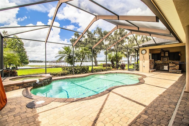 view of swimming pool featuring glass enclosure, ceiling fan, an in ground hot tub, and a water view