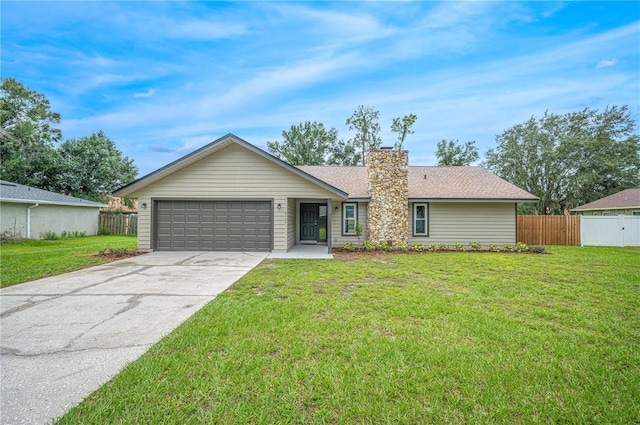 ranch-style house with a front yard and a garage