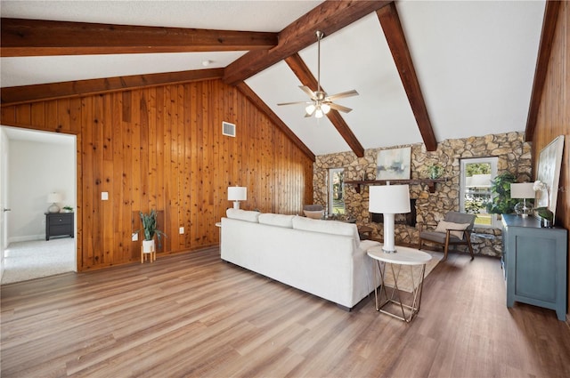 4500 Old Colony Rd, Mulberry, FL 33860 - living area featuring light wood-style flooring, wooden walls, and a ceiling fan