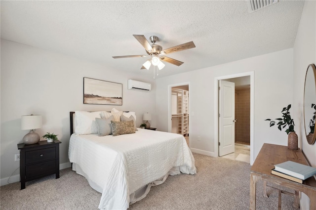 4500 Old Colony Rd, Mulberry, FL 33860 - bedroom with a wall unit AC, light carpet, a ceiling fan, ensuite bath, and a textured ceiling