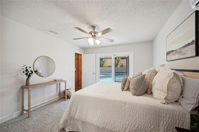 4500 Old Colony Rd, Mulberry, FL 33860 - bedroom with access to exterior, carpet, ceiling fan, a textured ceiling, and an AC wall unit