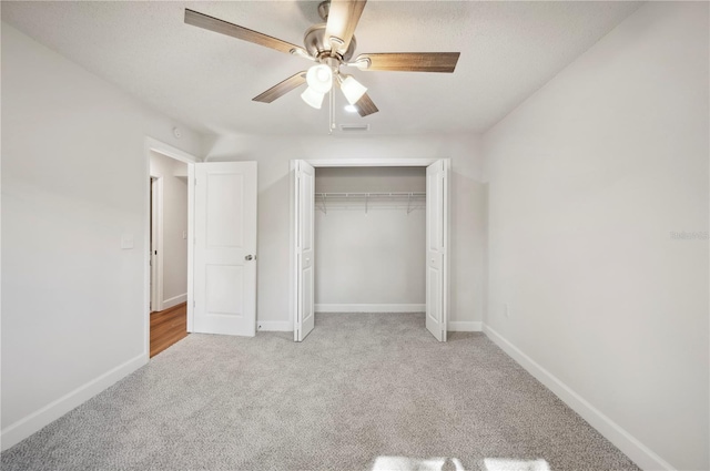 4500 Old Colony Rd, Mulberry, FL 33860 - unfurnished bedroom with light carpet, a closet, and a ceiling fan