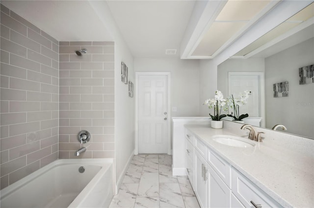 4500 Old Colony Rd, Mulberry, FL 33860 - bathroom featuring marble look tiles, vanity, and bathing tub / shower combination