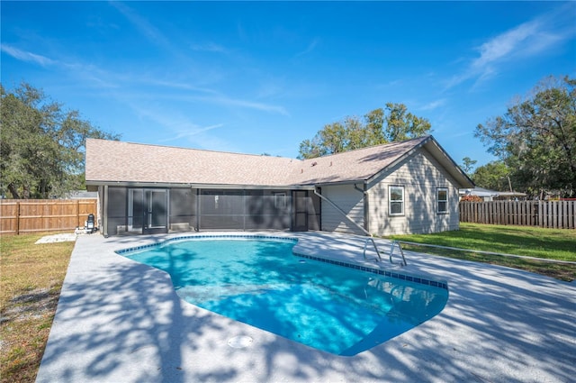 view of swimming pool with a yard and a patio