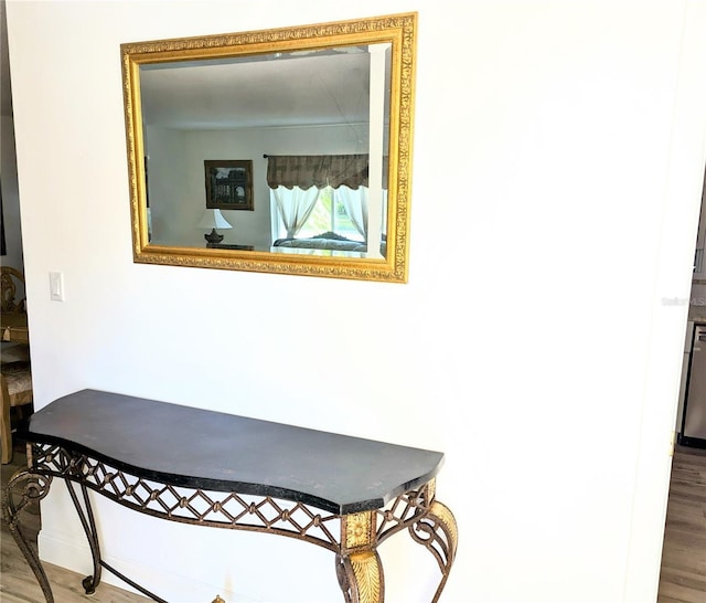 details with hardwood / wood-style flooring and dishwasher