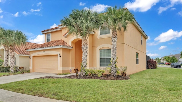 view of front of house with a garage, driveway, a tiled roof, stucco siding, and a front lawn