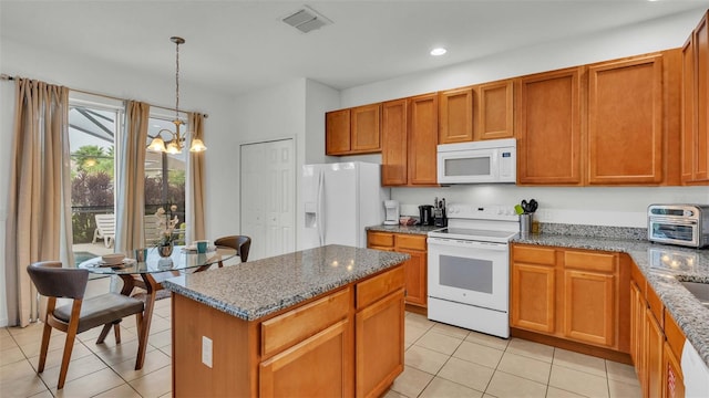 kitchen featuring white appliances, light tile patterned floors, visible vents, stone counters, and a chandelier