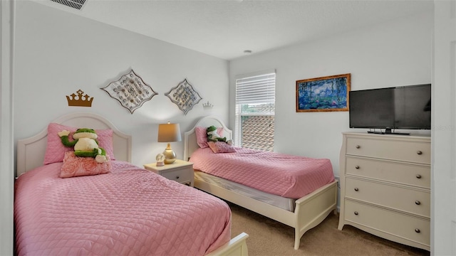 bedroom with carpet floors and visible vents