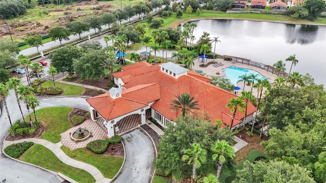 birds eye view of property with a water view