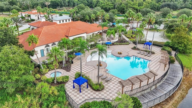 pool featuring a patio and a community hot tub