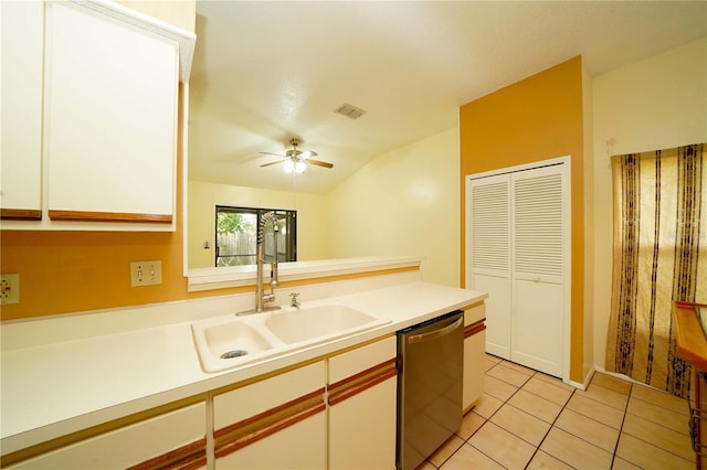 kitchen with dishwasher, vaulted ceiling, sink, white cabinets, and ceiling fan