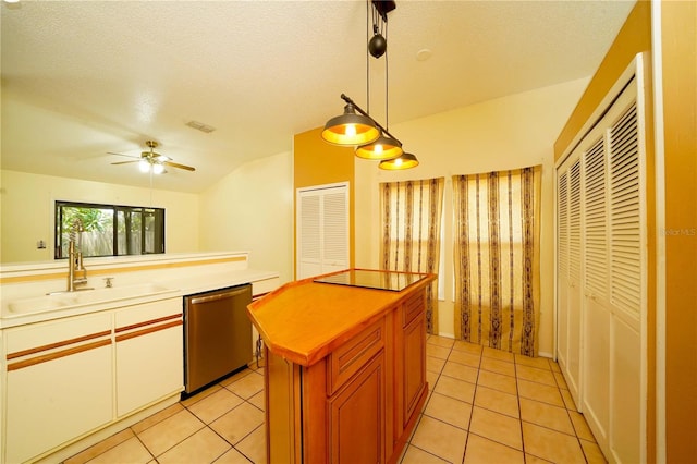 kitchen with dishwasher, sink, pendant lighting, ceiling fan, and light tile patterned flooring