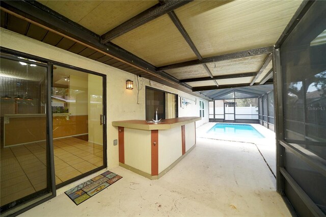 interior space featuring a lanai and an indoor pool