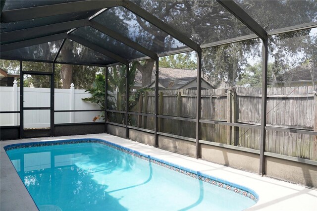 view of pool featuring a lanai