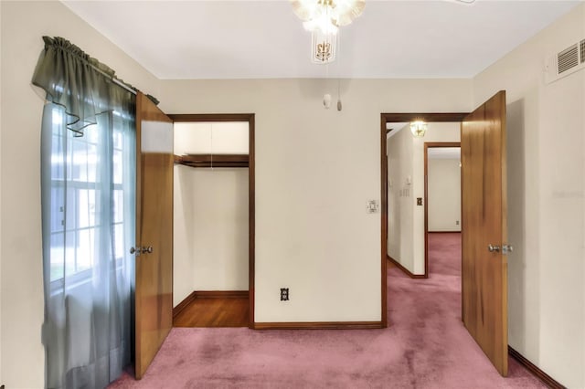 unfurnished bedroom featuring a closet and carpet