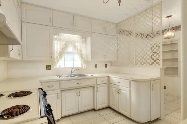 kitchen with sink, pendant lighting, custom range hood, and white cabinets