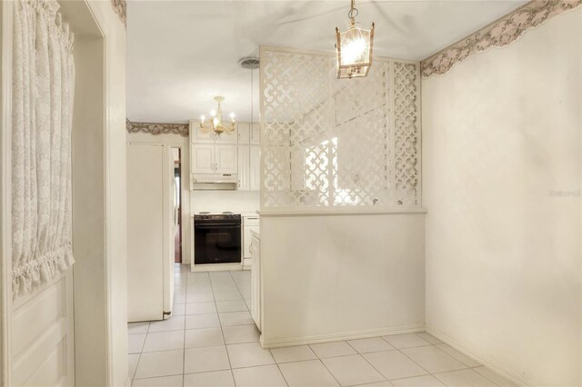 kitchen with a chandelier, oven, pendant lighting, black electric range oven, and light tile patterned flooring