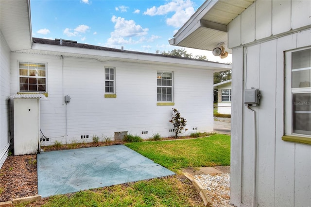 exterior space featuring a patio area and a yard