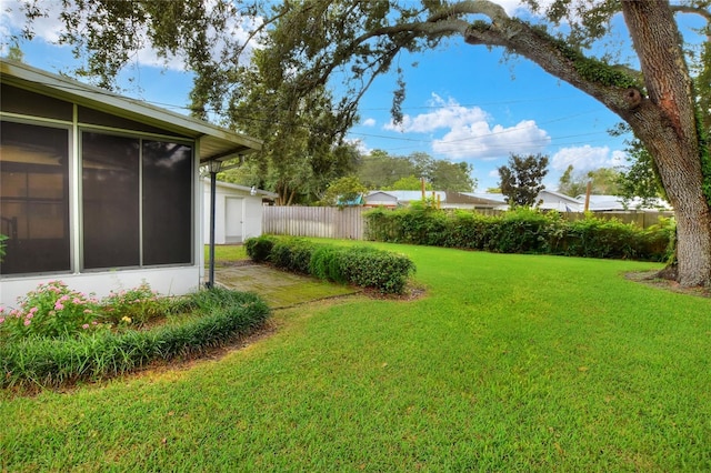 view of yard featuring a sunroom