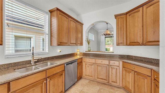 kitchen with stainless steel dishwasher, a sink, a chandelier, crown molding, and light tile patterned floors