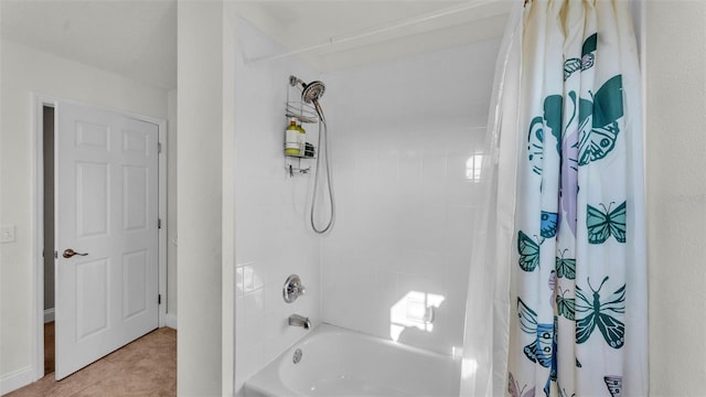 bathroom with shower / bath combination with curtain and tile patterned floors