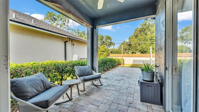 view of patio / terrace featuring a ceiling fan and fence