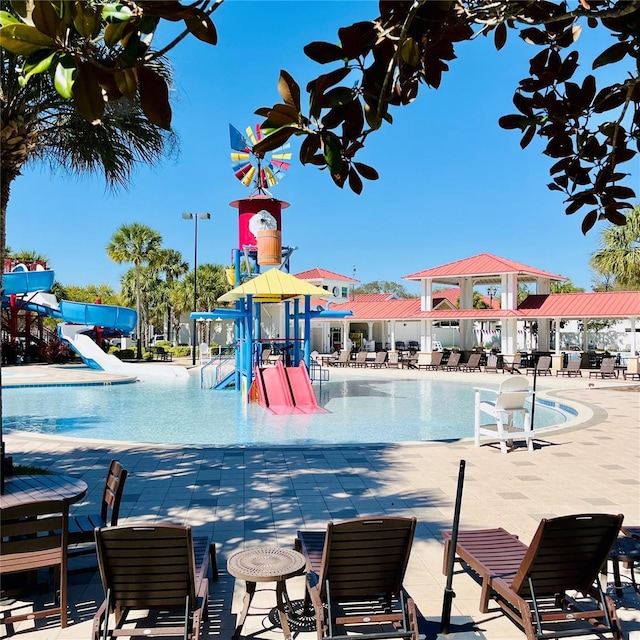 1918 Dr Martin L King Jr Way, Haines City, FL 33844 - community pool with a water slide, a water play area, and a patio area