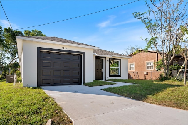 ranch-style home featuring a front yard and a garage