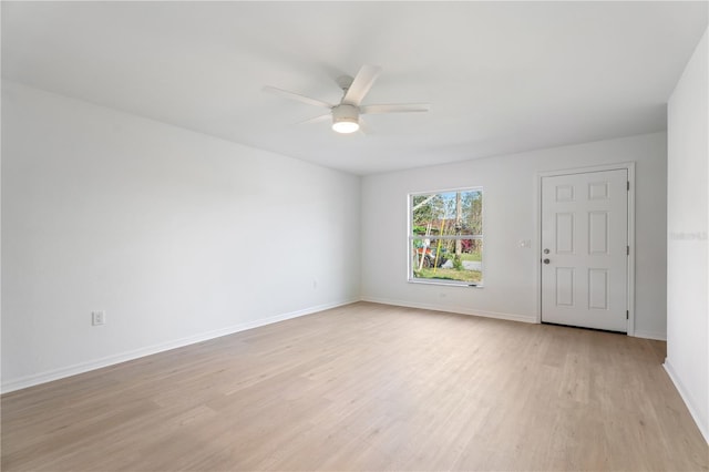 spare room with light hardwood / wood-style flooring and ceiling fan