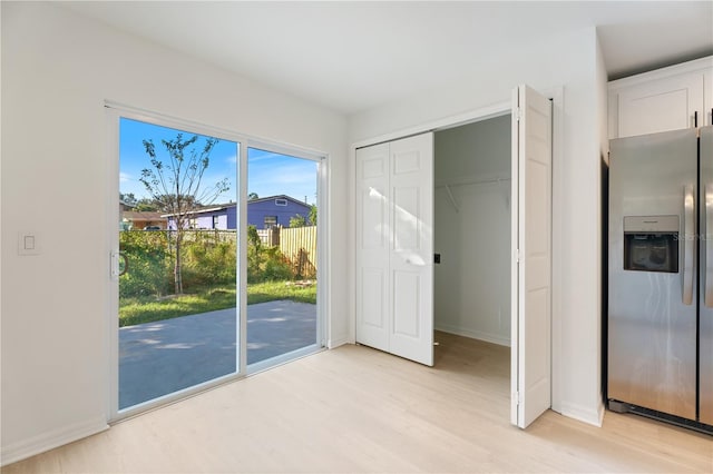 doorway to outside featuring light wood-type flooring