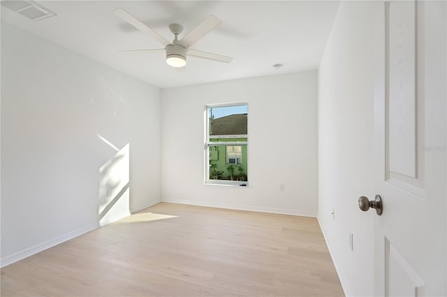 empty room featuring ceiling fan and light wood-type flooring