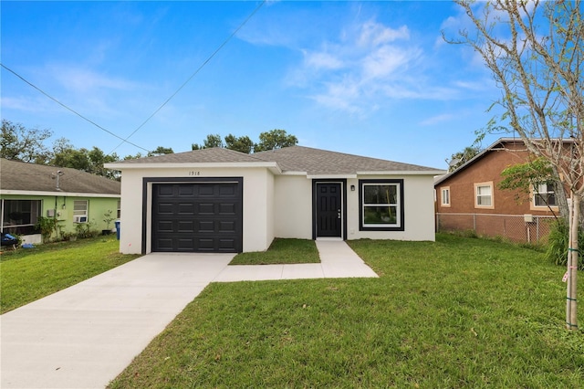 single story home featuring a front yard, concrete driveway, an attached garage, and stucco siding