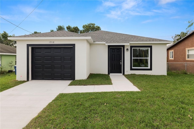 ranch-style house featuring driveway, roof with shingles, fence, a front lawn, and stucco siding