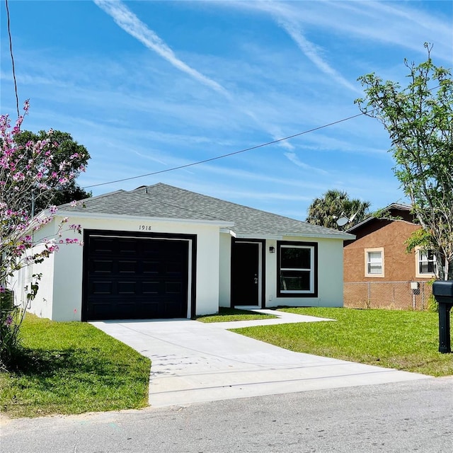 1918 Dr Martin L King Jr Way, Haines City, FL 33844 - ranch-style house with stucco siding, an attached garage, and concrete driveway