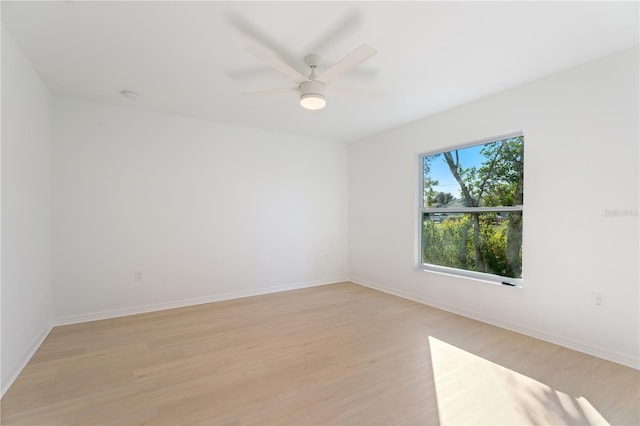 1918 Dr Martin L King Jr Way, Haines City, FL 33844 - unfurnished room with light wood-style flooring, baseboards, ceiling fan, and a smoke detector