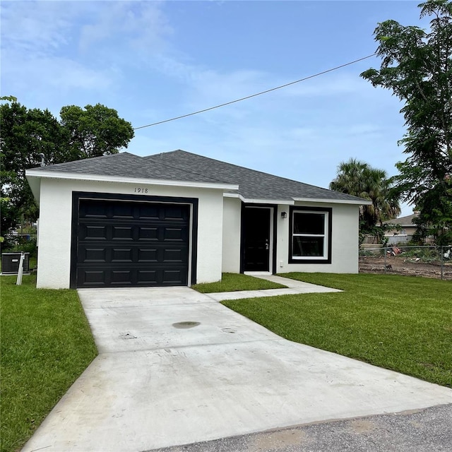 1918 Dr Martin L King Jr Way, Haines City, FL 33844 - single story home featuring stucco siding, a front lawn, concrete driveway, and roof with shingles