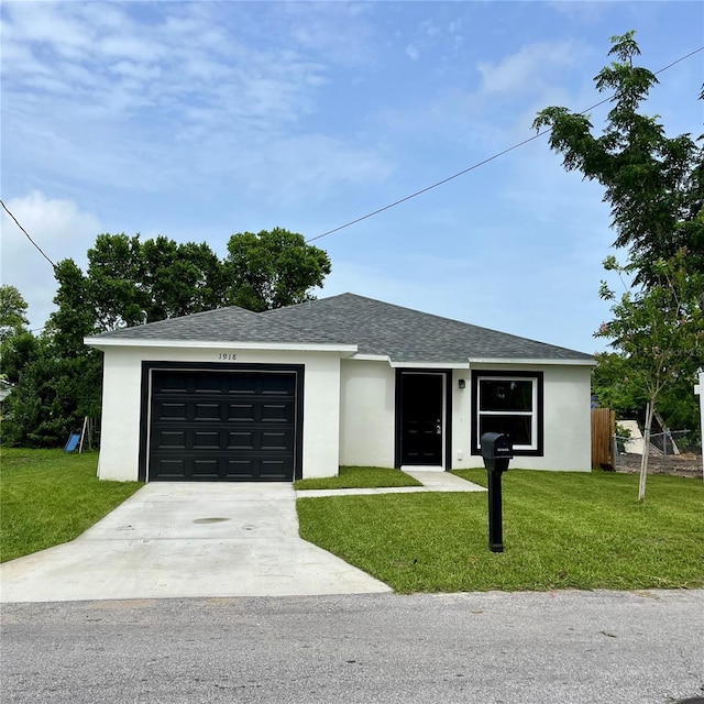 1918 Dr Martin L King Jr Way, Haines City, FL 33844 - ranch-style house featuring an attached garage, concrete driveway, stucco siding, and roof with shingles