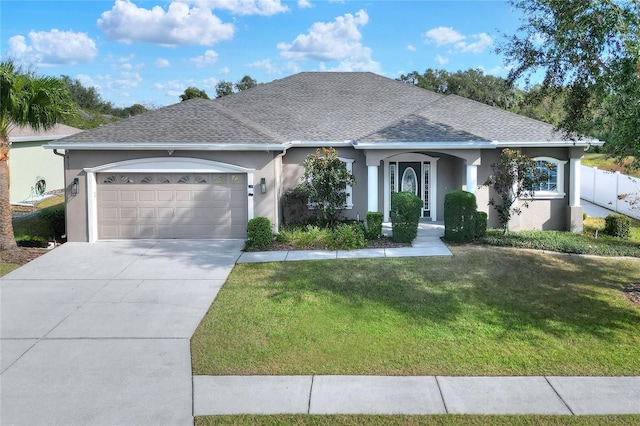 ranch-style home with a front lawn and a garage