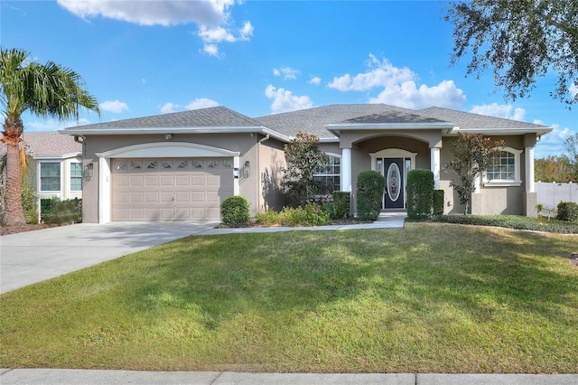 view of front facade featuring a front yard and a garage