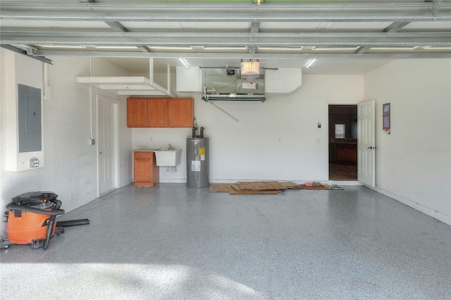 garage with electric panel, electric water heater, and sink