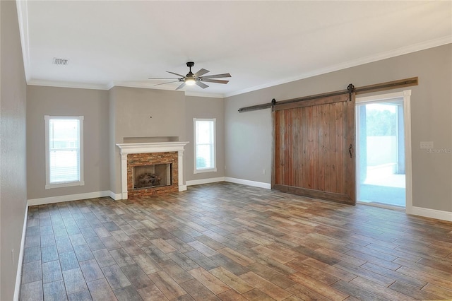 unfurnished living room featuring wood-type flooring, ceiling fan, and crown molding