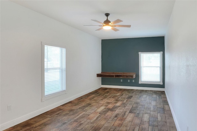 spare room with wood-type flooring and ceiling fan