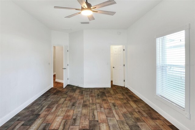 unfurnished bedroom with dark hardwood / wood-style floors and ceiling fan