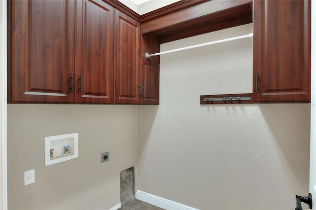 washroom featuring hookup for an electric dryer, cabinets, and hookup for a washing machine